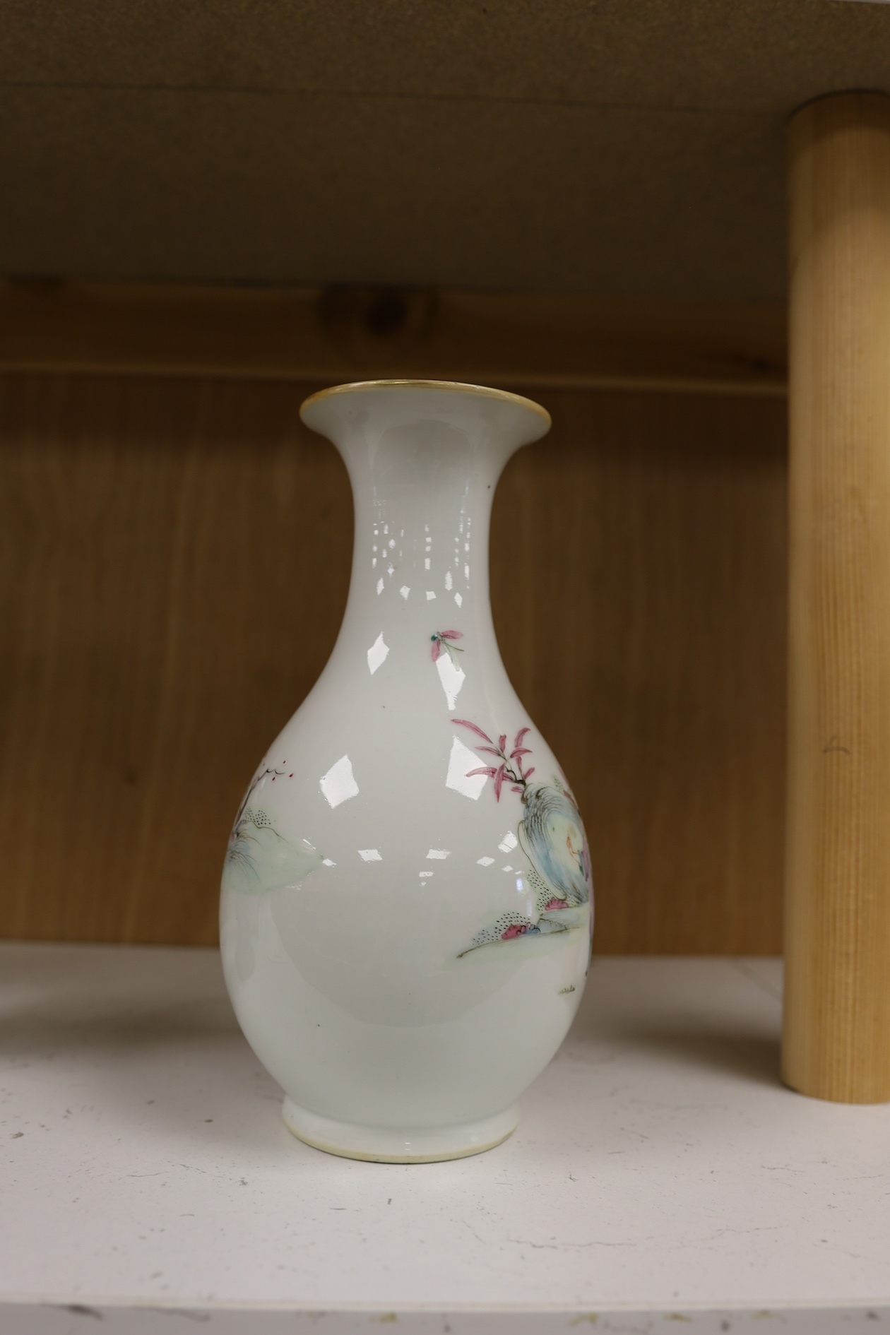 A Chinese porcelain famille rose vase, Qianlong red seal mark to the base, but early 20th century, 22cm high. Condition - good